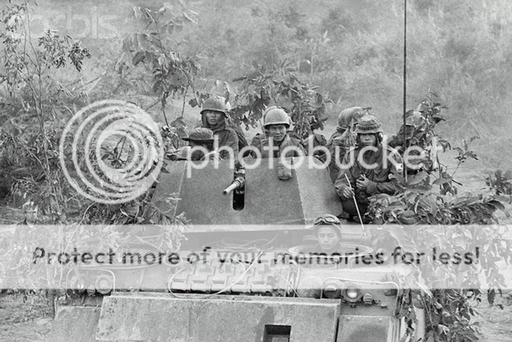  photo 09 Feb 1971- On To Laos. Laotian Border South Vietnam Vietnamese soldiers in a camouflaged tankmoved down route 9 and into Laos.jpg