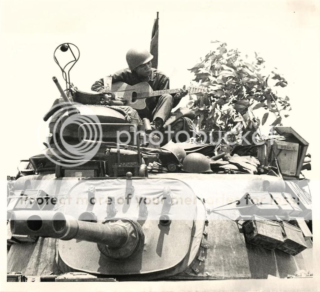  photo 1972- South Vietnamese soldier playing guitar atop tank on Highway 1 near Quang Tri 2..jpg