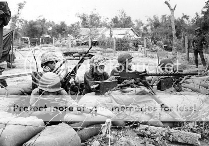  photo Manning a perimeter position near Da Nang men of the 768th Regional Forces Company display their new firepower M-16 rifles m-79 grenade launcher and an older but reliable .30 caliber m.jpg