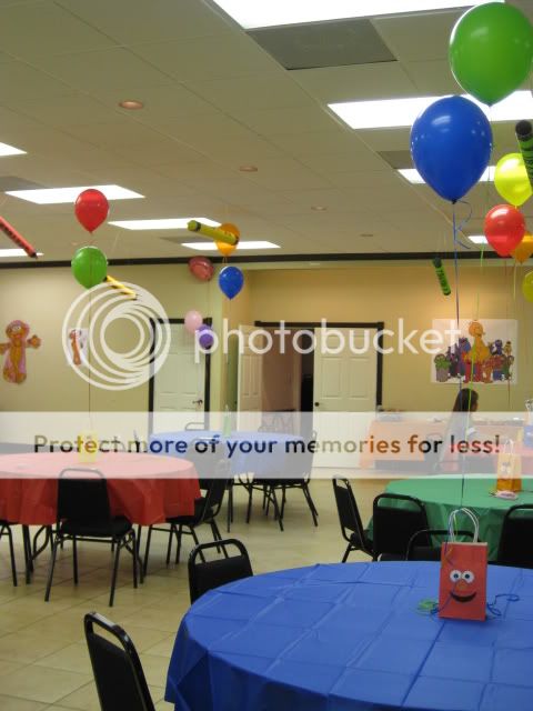 Sesame Street Faces on bags used as balloon weight centerpieces